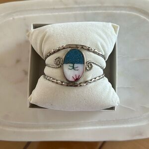 Silver cuff bracelet.